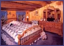 Adding a quilt to a den invites relaxing in.